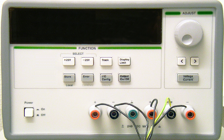 Front panel of the Hive triple DC power supply with voltage and current displays, output controls, and colored terminals.